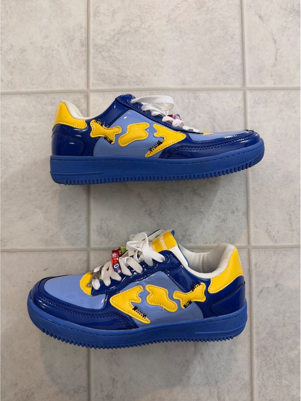 Blue and yellow low top sneakers